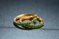 Diopside Half-Eternity Hoop Earrings in gold-tone metal with natural diopside