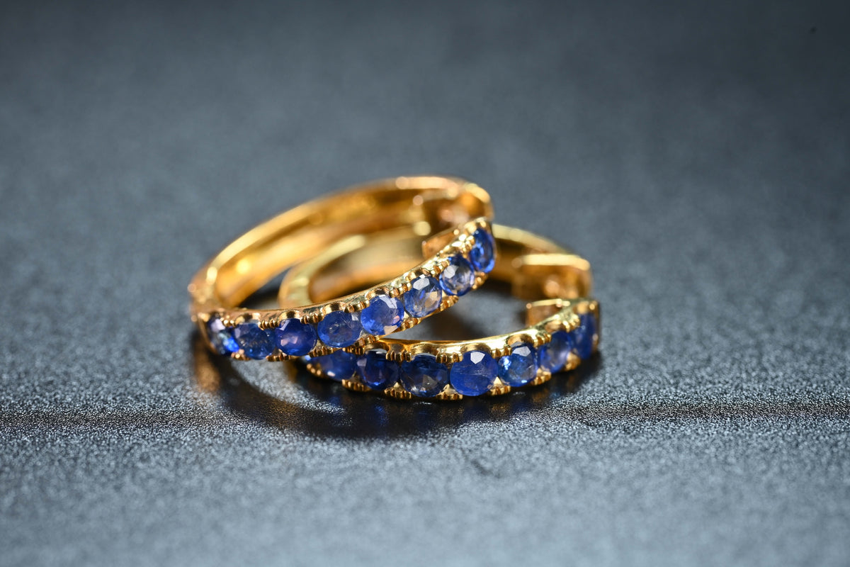 Sapphire Half-Eternity Hoop Earrings in gold-tone metal with natural sapphire